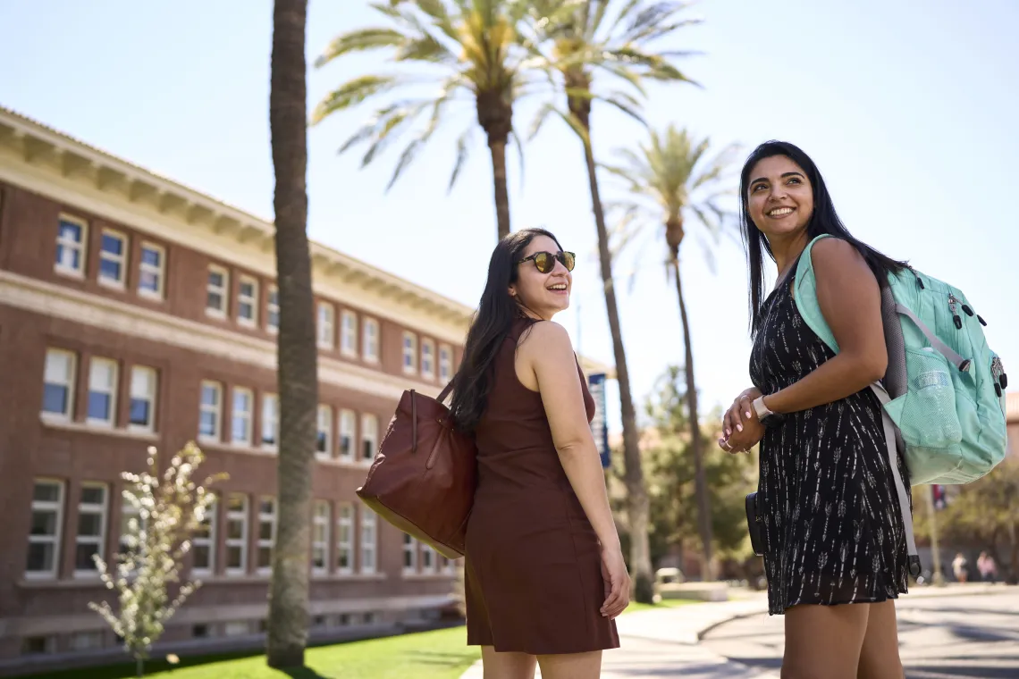 two female students walking on campus