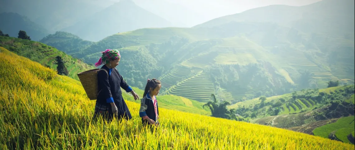 a woman and girl on a mountain