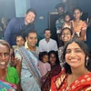 Aaron-Womack-and-Anusha-Sharma-with-host-familiy.jpg.webp
